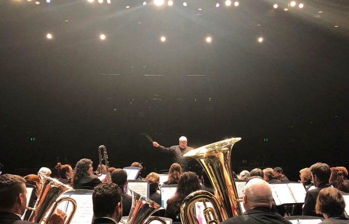 Pete Nowlen, artistic director, conducts the concert band