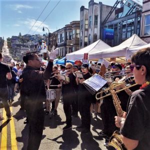 The San Francisco Pride Pep Band plays on Castro Street during the Castro Street Fair