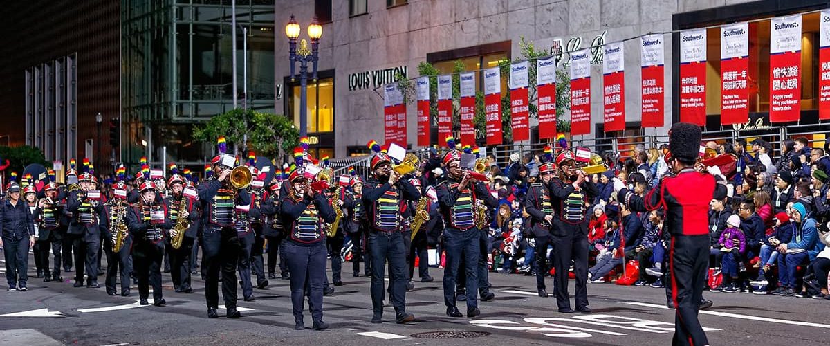SF Lesbian/Gay Freedom Marching Band plays in front of the grandstand seating at the SF Chinese New Year Parade in 2019