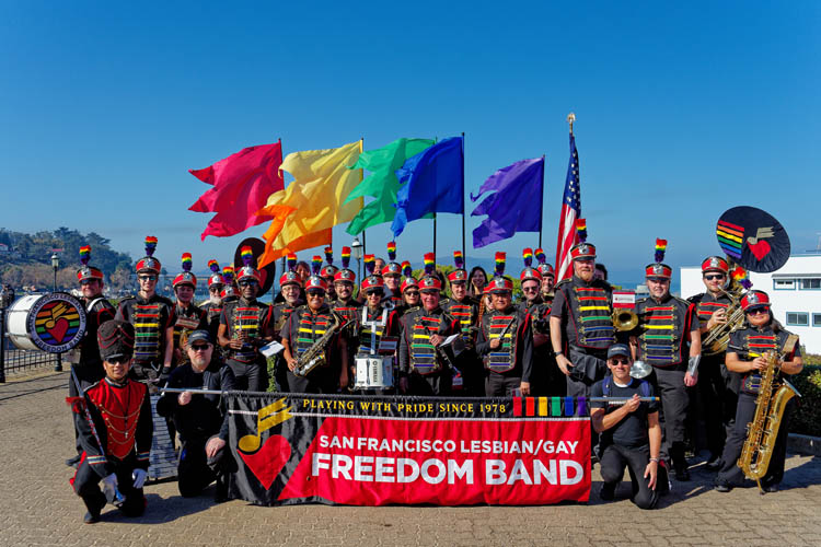 The Marching Band poses for a picture after the SF Veterans Day Parade