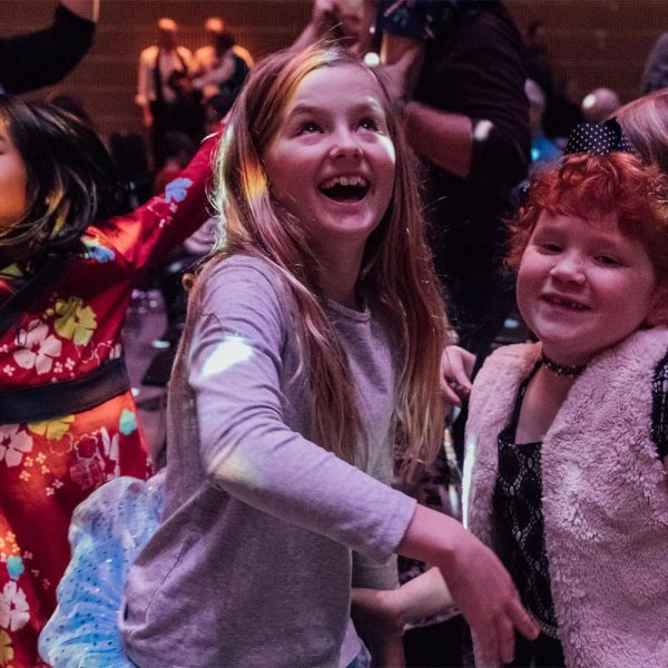 Children dancing and smiling during the interactive Dance-Along Nutcracker® performance at YBCA